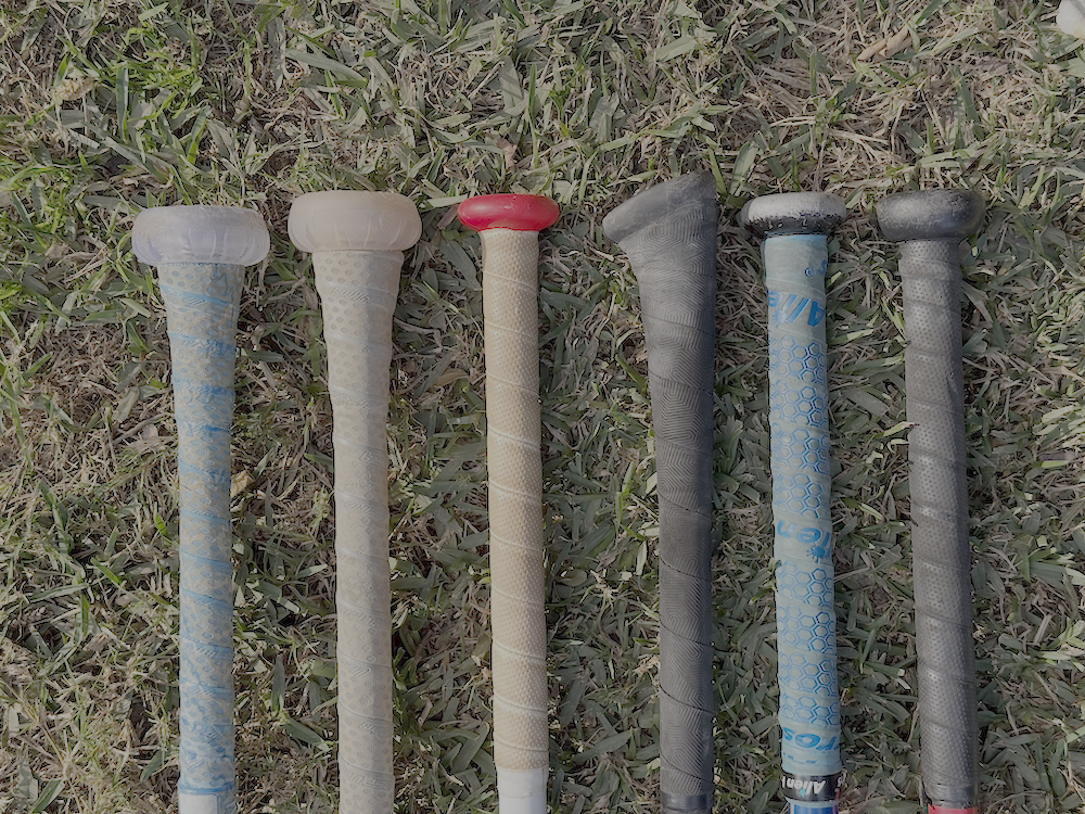 Close-up view of different bat handle designs and grips
